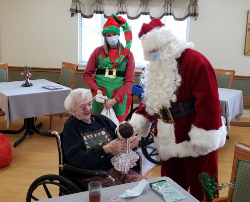 Ashley Larochelle and Santa Claus with Lucys for Lynn