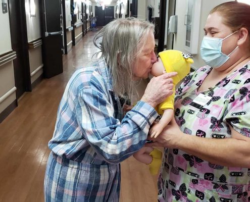 An Alzheimer's patient with a Lucys for Lynn doll