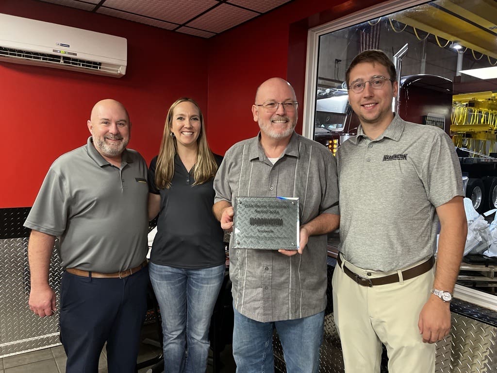 CraneWerks is presented their 7th Distributor Excellence Award by Harrington Hoists. (L to R): Brett Kunin, Ashley Larochelle, Dave Sims, and J.J. Politis